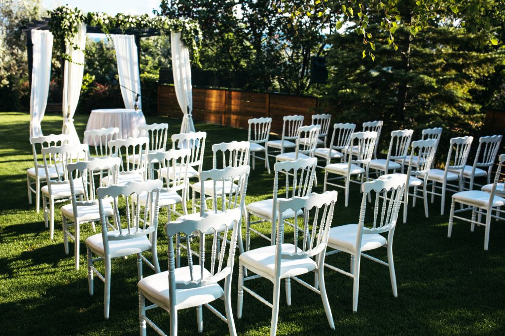 Seats in front of arbour at Wedding Ceremony